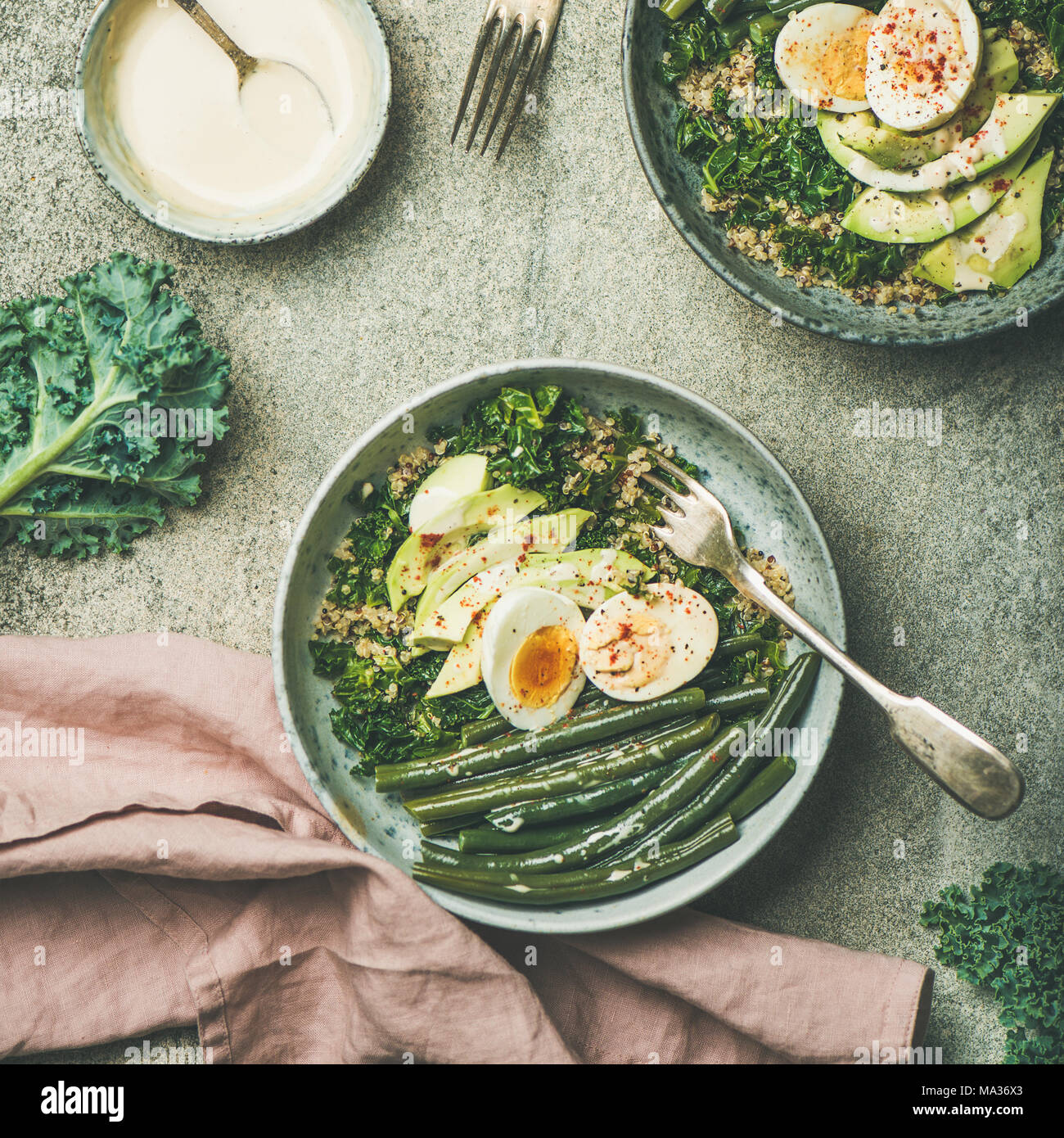 Quinoa, kale, green beans, avocado, egg bowls, square crop Stock Photo Alamy