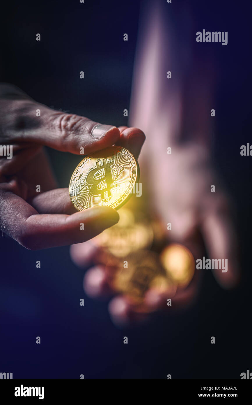 Man holding in hand symbol of crypto currency, selective focus Stock Photo