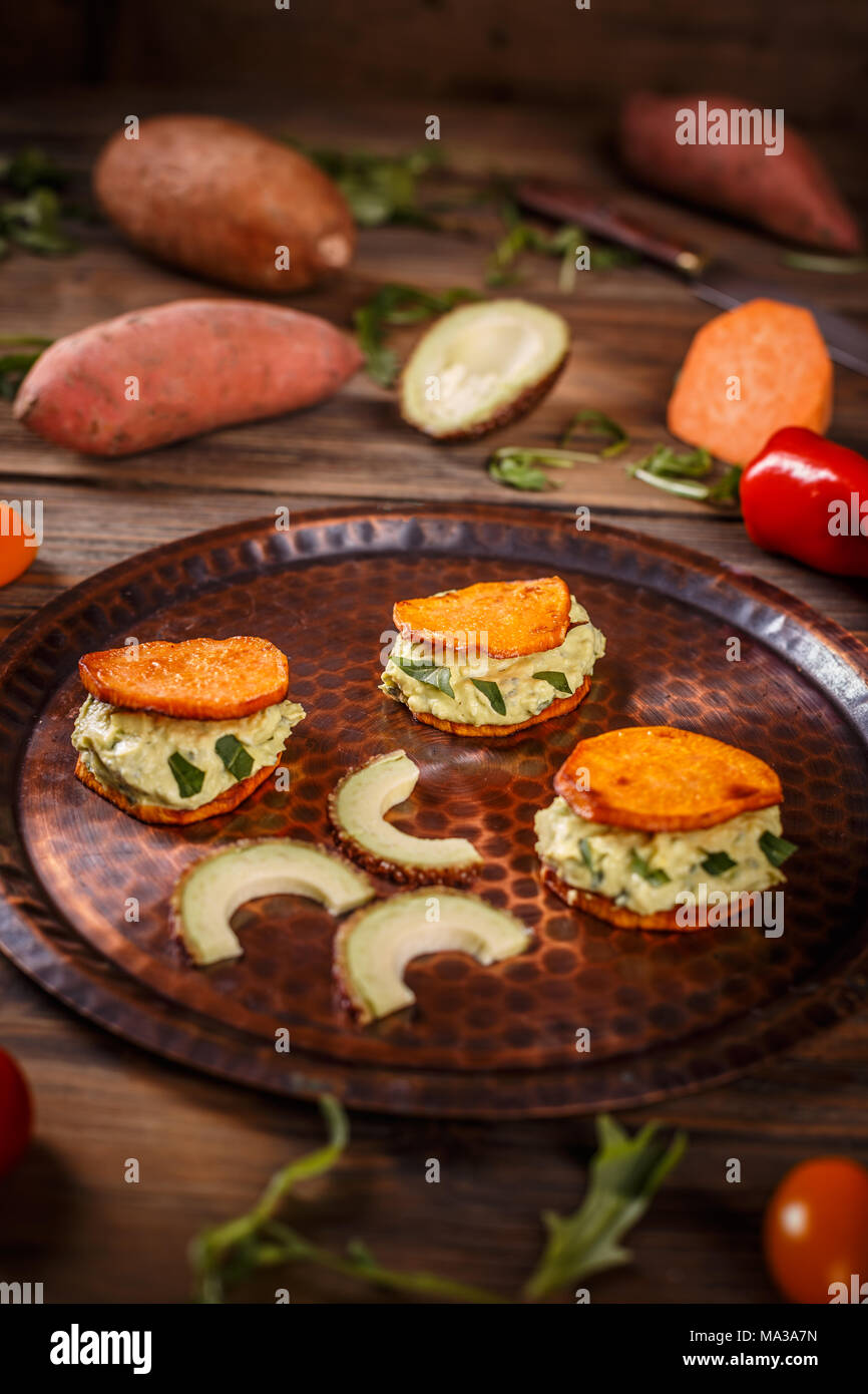 Delicious vegetarian food, avocado cream and sweet potato Stock Photo