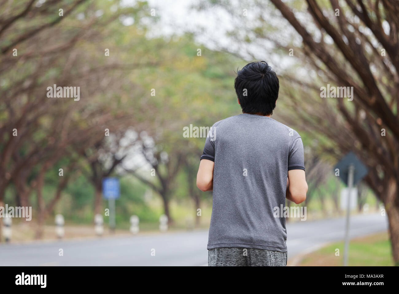 Young male athlete running path hi-res stock photography and images - Alamy