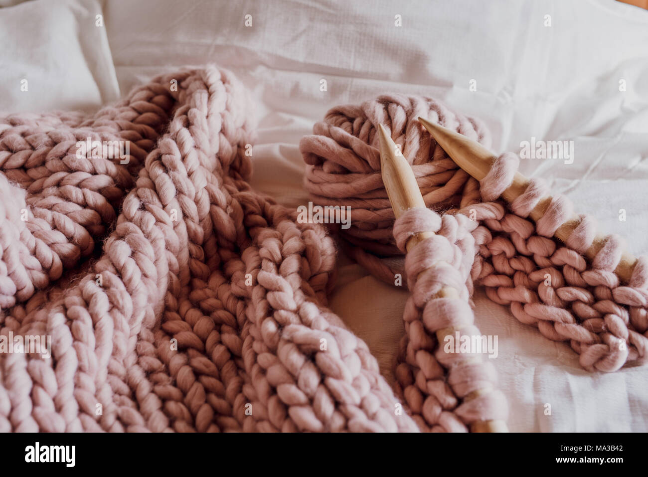 XXL knitting things in pink Stock Photo