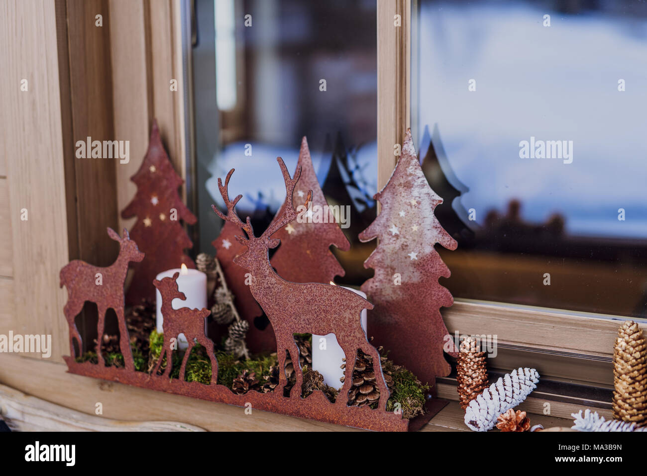 Windowsill,decoration,candlesticks and cones, Stock Photo