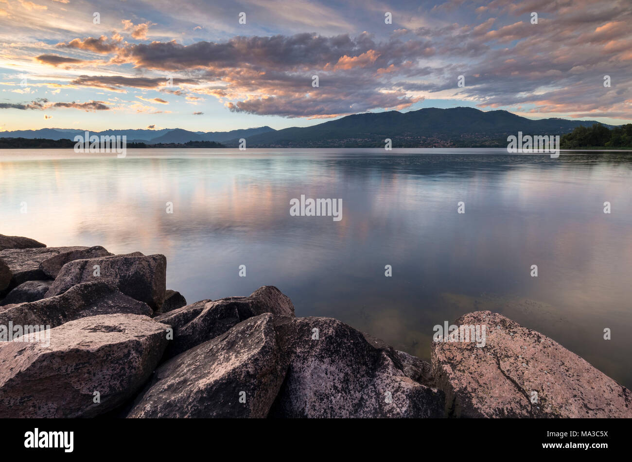 A summer sunset reflecting on Lake Varese at Cazzago Brabbia harbour, Varese Province, Lombardy, Italy. Stock Photo