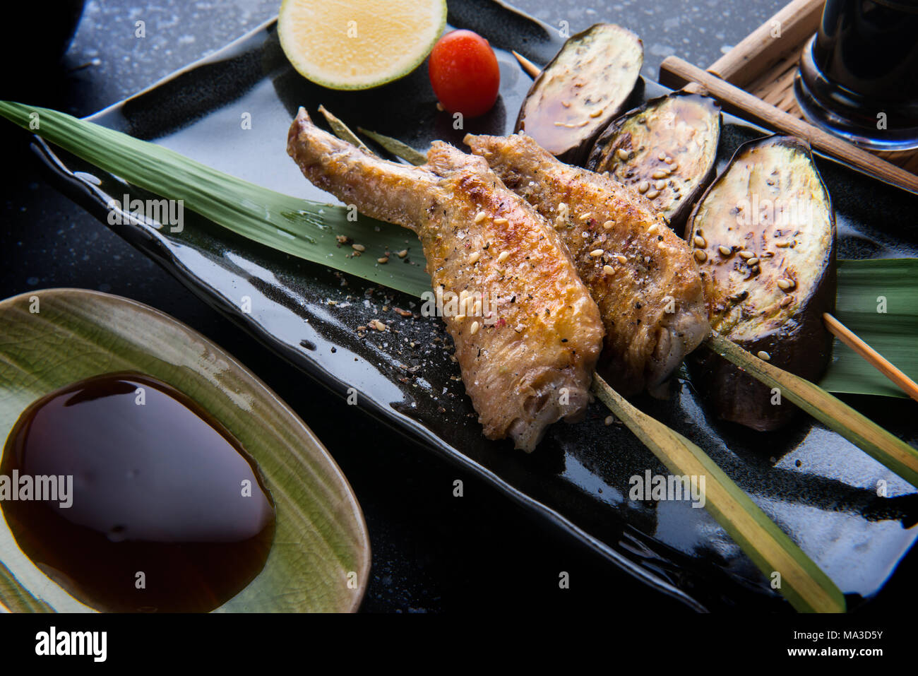 Grill chicken wing with salt seasoning in Japanese skewer grill food