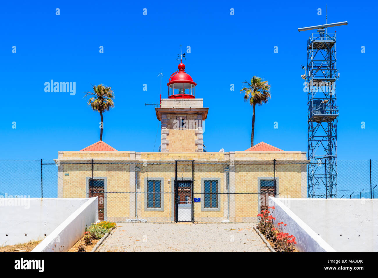 View of lighthouse near Cabo de Sao Vicente on coast of Atlantic Ocean, Algarve region, Portugal Stock Photo