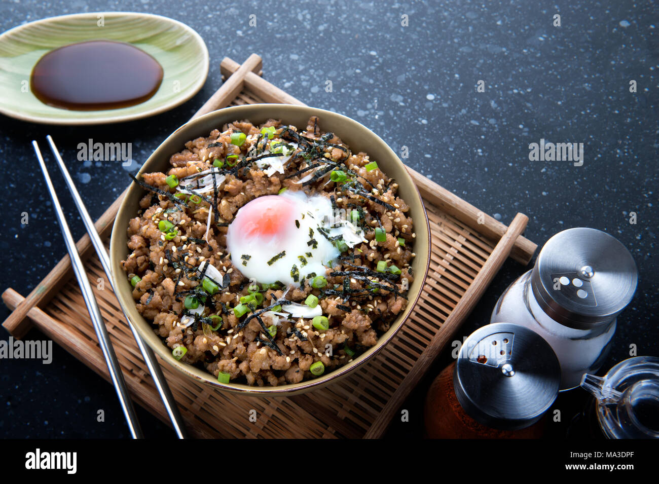 Japanese ground beef bowl with steamed egg on top and ingredient Stock