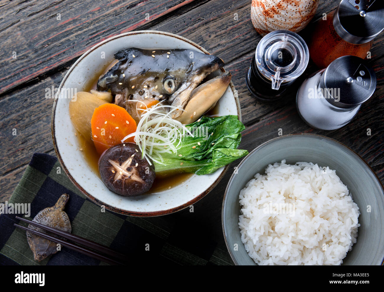 Salmon head in soya soup steamed with ingredient in Japanese style food
