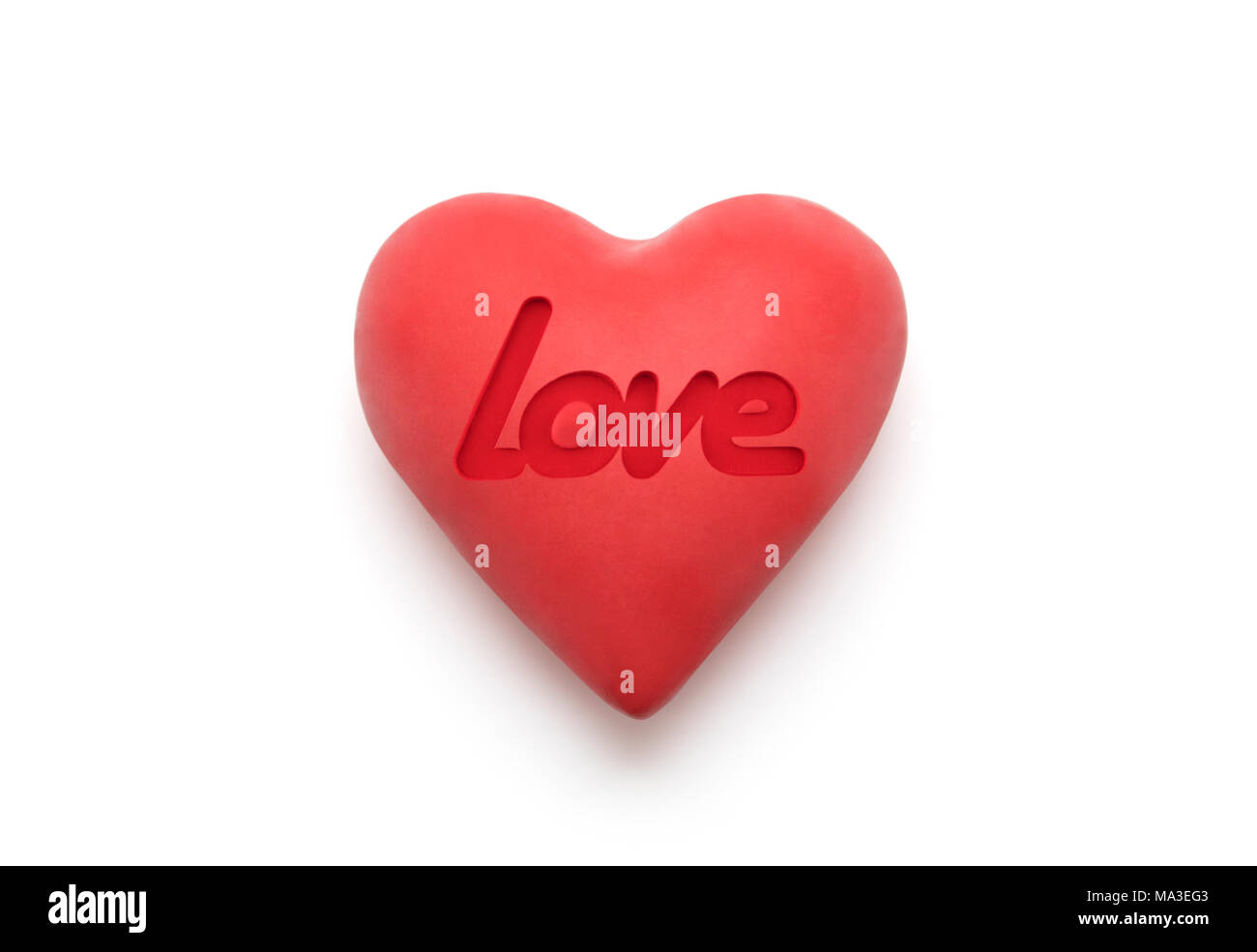 Red heart with imprinted love word over white background with clipping path Stock Photo