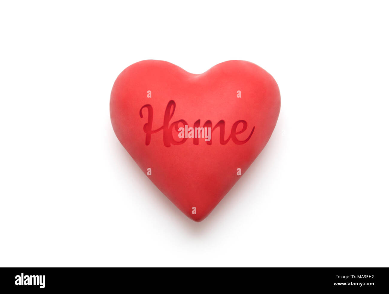 Red heart with imprinted home word over white background with clipping path Stock Photo