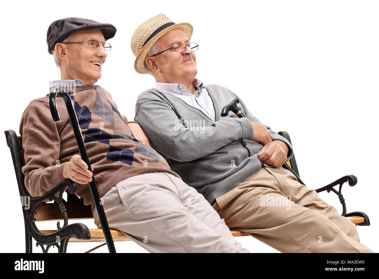 Two old men sitting on bench hires stock photography and