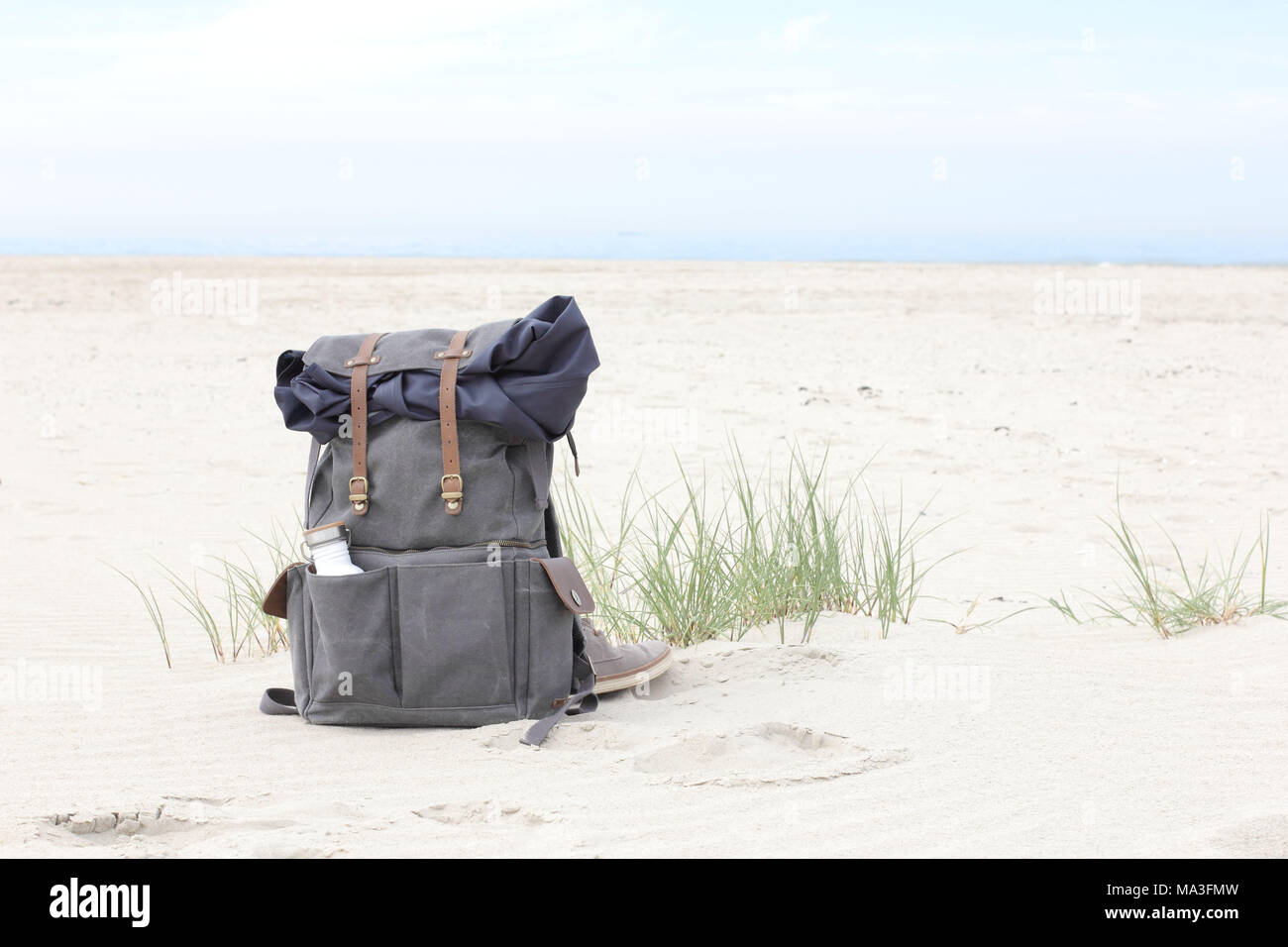 Backpack on beach Stock Photo Alamy