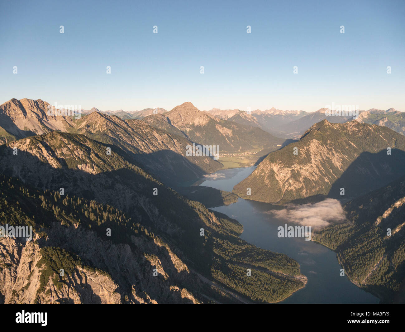 Aerial Photo of Plansee lake after sunrise Stock Photo