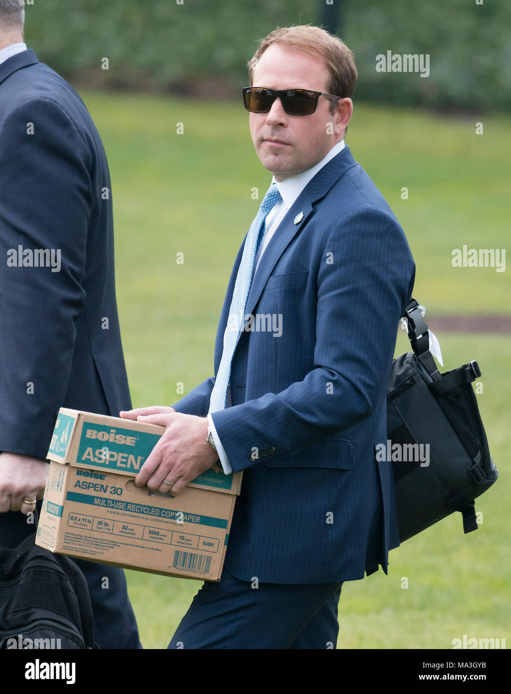 White House Deputy Director of Presidential Advance Jordan Karem carries a  box of papers to Marine One as he prepares to accompany United States  President Donald J. Trump as he departs the