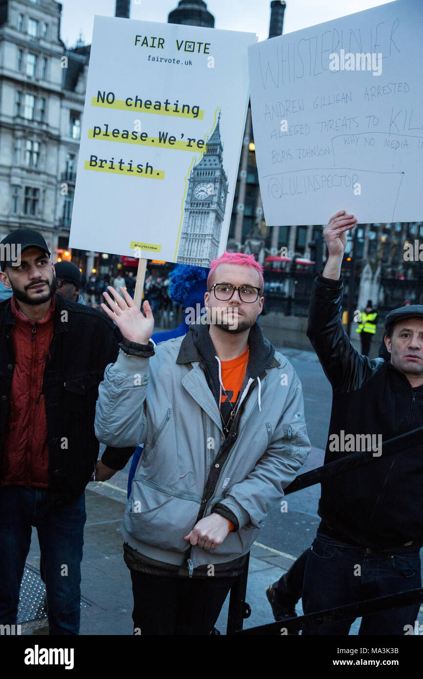 London, UK. 29th March, 2018. Cambridge Analytica whistleblower Christopher Wylie and Vote Leave whistleblower Shahmir Sanni wait to address a rally in Parliament Square organised by the Fair Vote Project, which was set up to support whistleblowers like him and Shahmir Sanni and to ensure that evidence of unfair voting by either side in the referendum regarding the UK’s membership of the European Union is exposed. Credit: Mark Kerrison/Alamy Live News Stock Photo