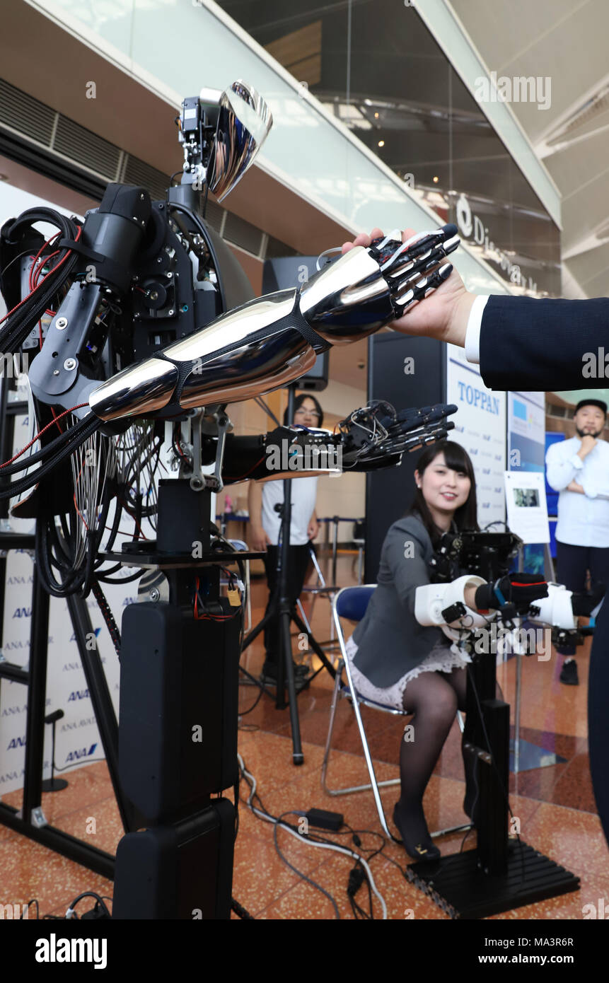 Tokyo, Japan. 29th Mar, 2018. A woman demonstrates Japan's robotics company  MELTIN's master-slave robot MELTANT-alpha as ANA announces that ANA will  sponsor the 10 million US dollars "ANA Avator Vision" XPRIZE competition