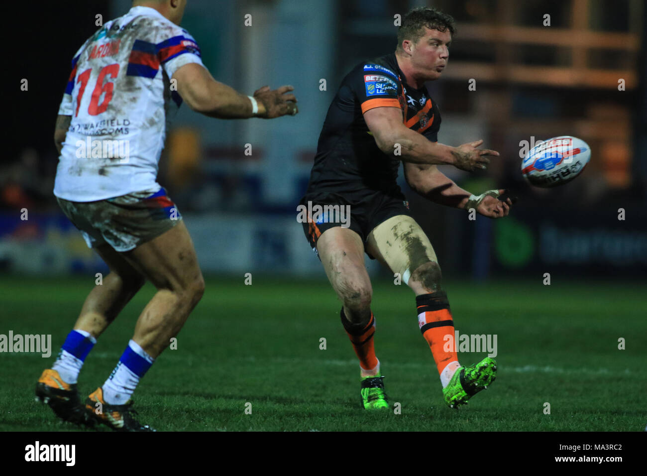 Wakefield, UK. 29th March 2018 , Mobile RocketStadium, Wakefield, England; Betfred Super League rugby, Wakefield Trinity v Castleford Tigers; Adam Milner of Castleford Tigers offloads Credit: News Images/Alamy Live News Stock Photo