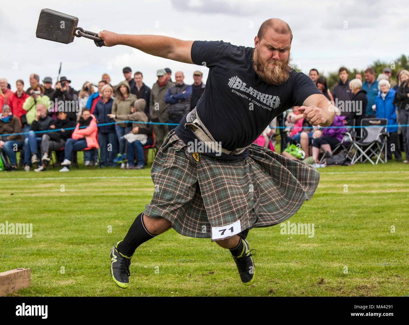 A weight thrower at the Highland Games in Dornoch, Scotland Stock Photo