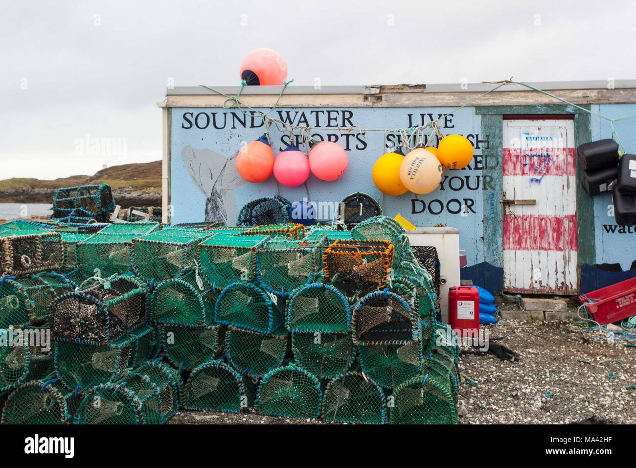A fishing hut in Leverburgh Harbour on the island of Harris in Scotland Stock Photo