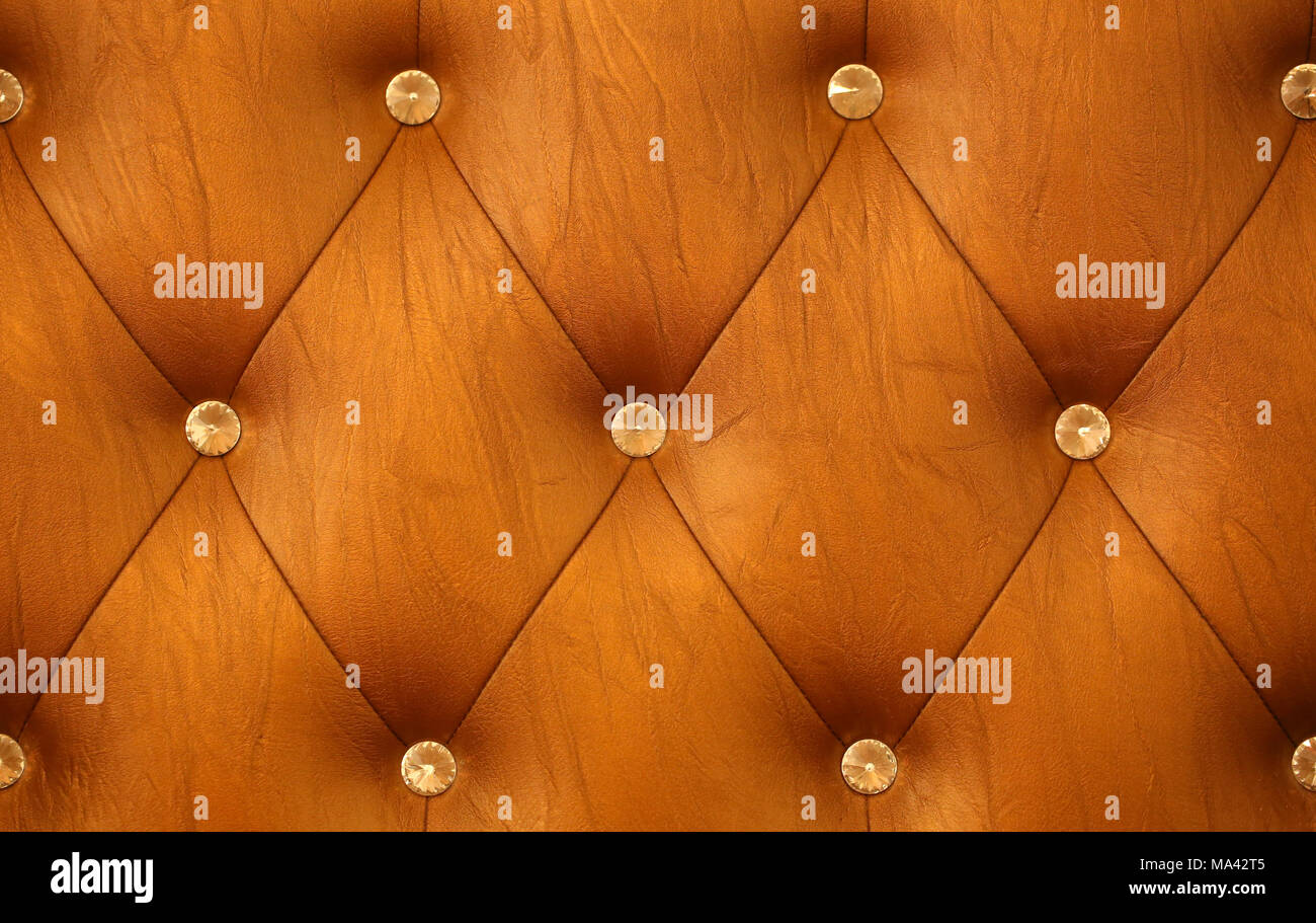 Orange sofa leather background Stock Photo - Alamy