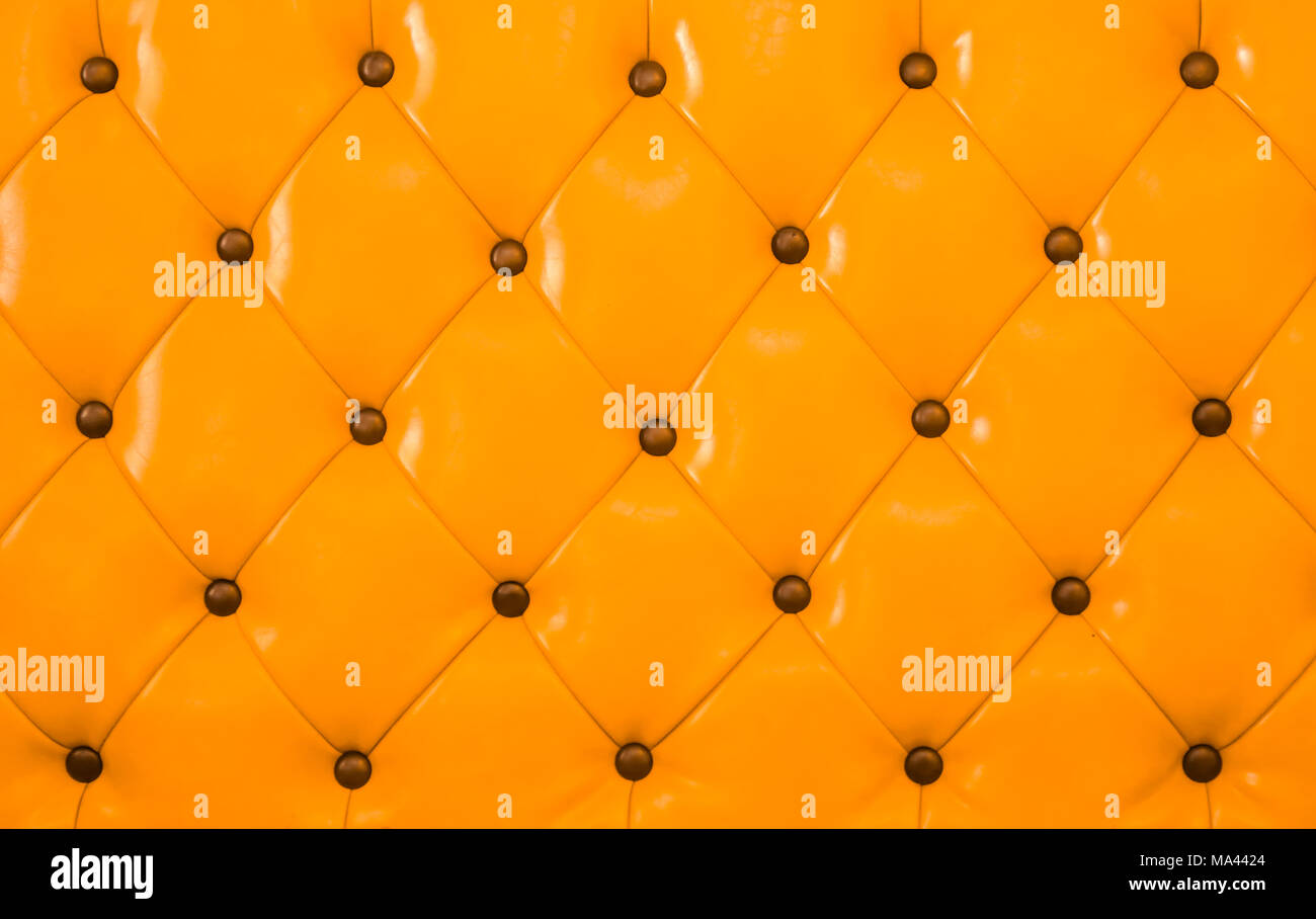 Orange sofa leather background Stock Photo - Alamy