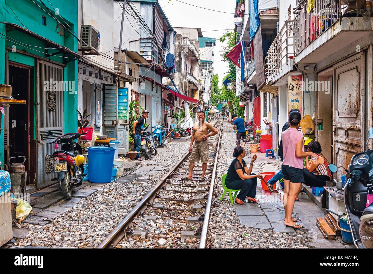 Bustling activity on the train tracks in Hanoi, Vietnam Stock Photo Alamy