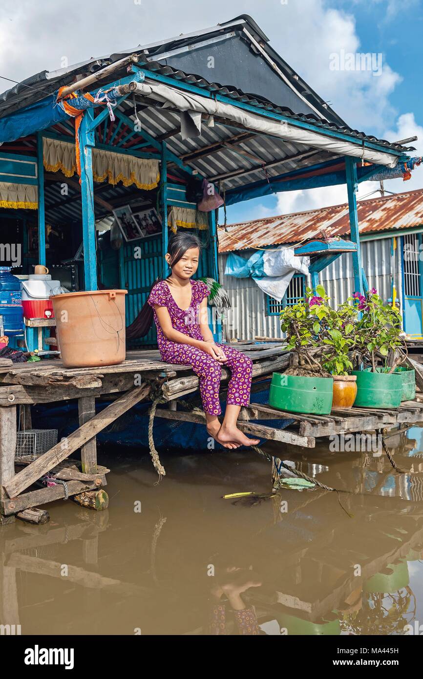 A young girl on a houseboat on the Mekong Delta in Vietnam Stock Photo