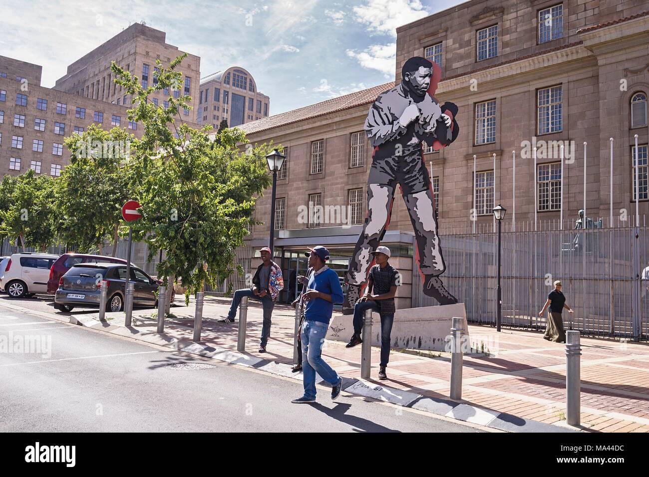 'The Shadow Boxer' sculpture by artist Marco Cianfanelli in front of the local court in the artist quarter of Maboneng in Johannesburg, South Africa Stock Photo