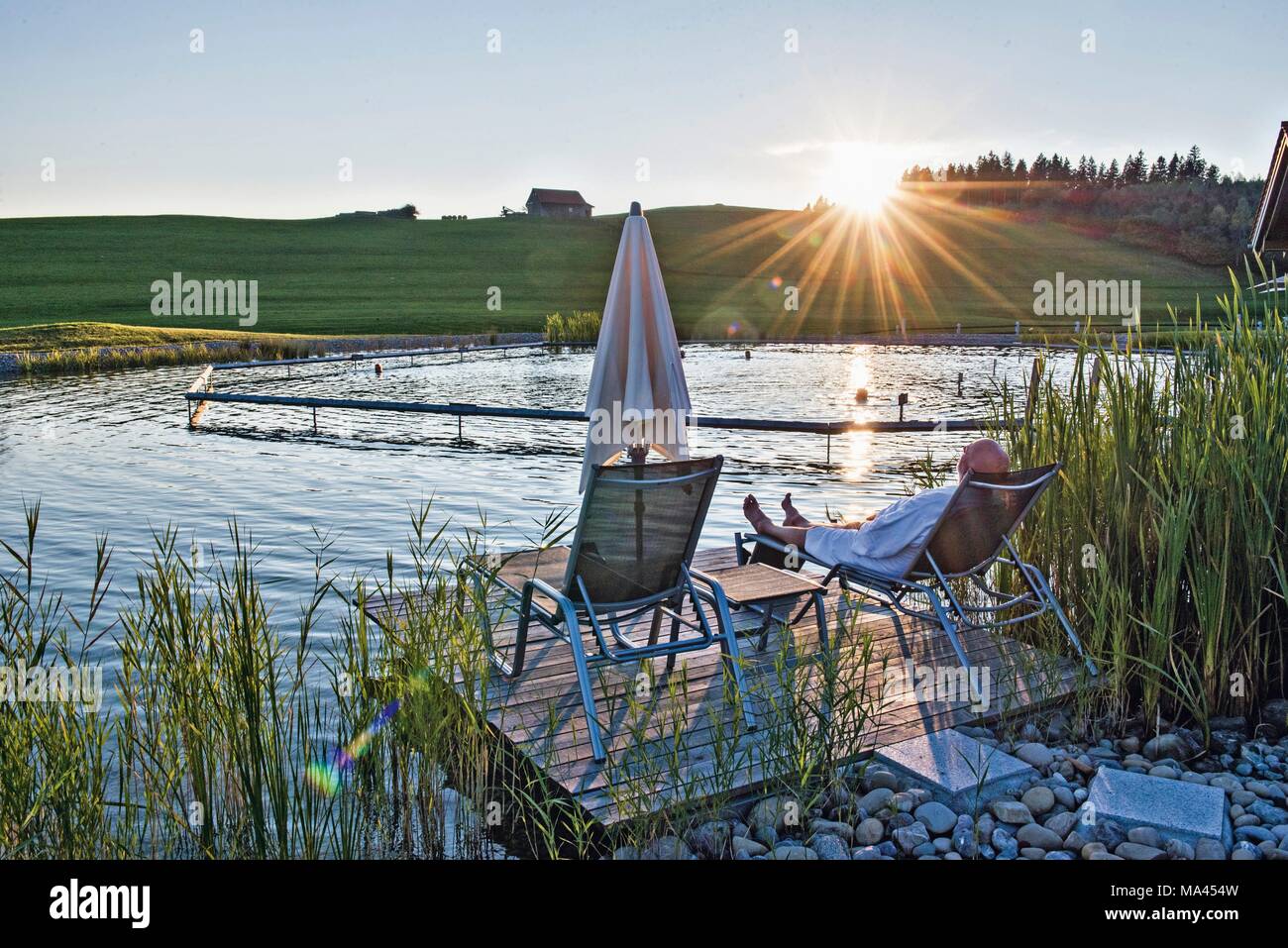 Relaxing at the lake at 'Haubers Alpenresort' in the Allgäu region of Germany Stock Photo