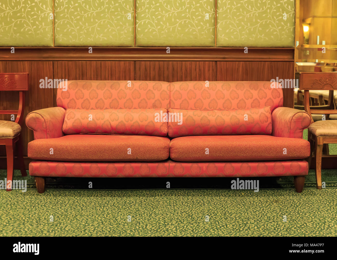 Orange sofa in the living room Stock Photo - Alamy