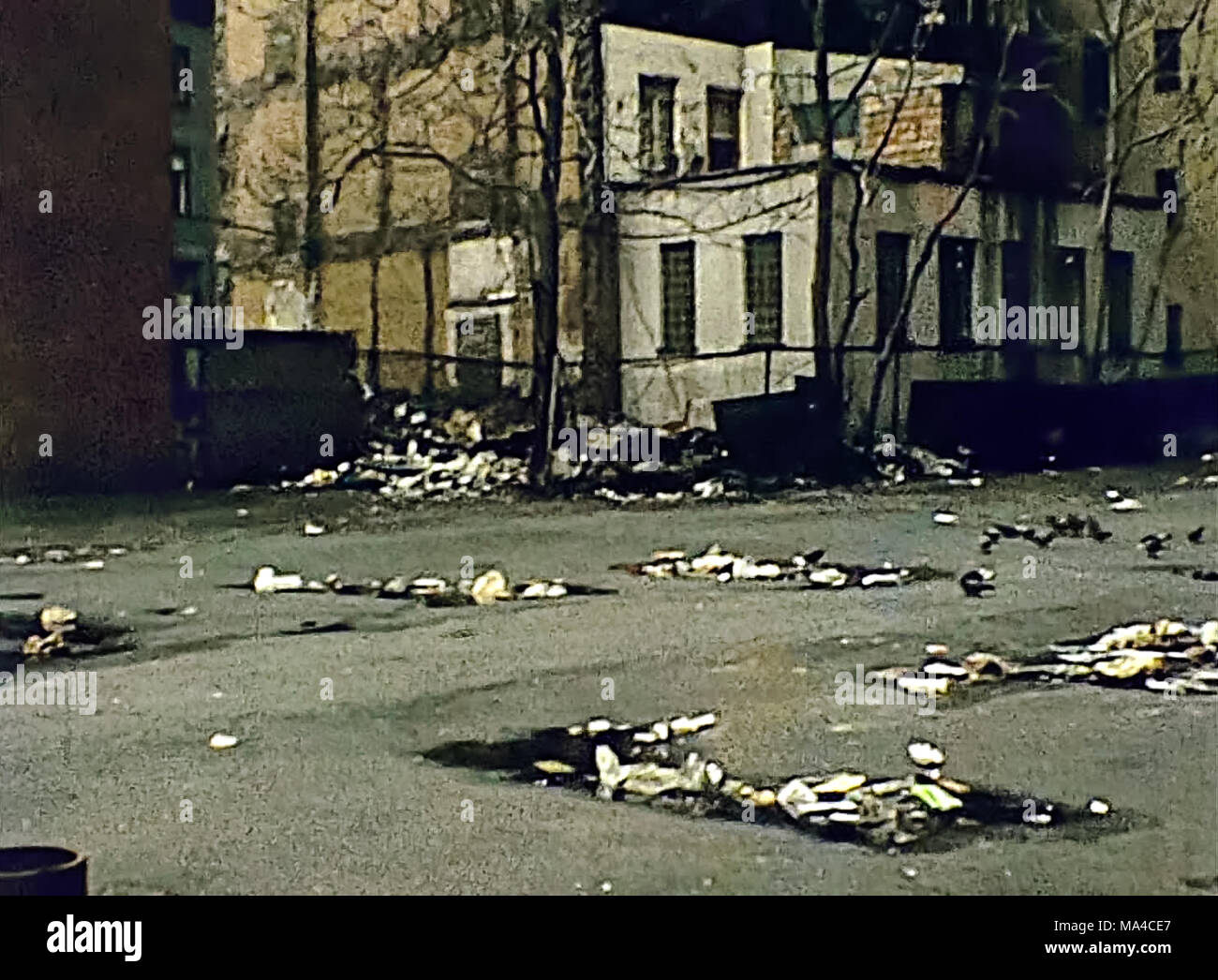 Old Manhattan alley with garbage on the dirty street in old New York, United States of America in 1981. Archival USA on 80s. Stock Photo