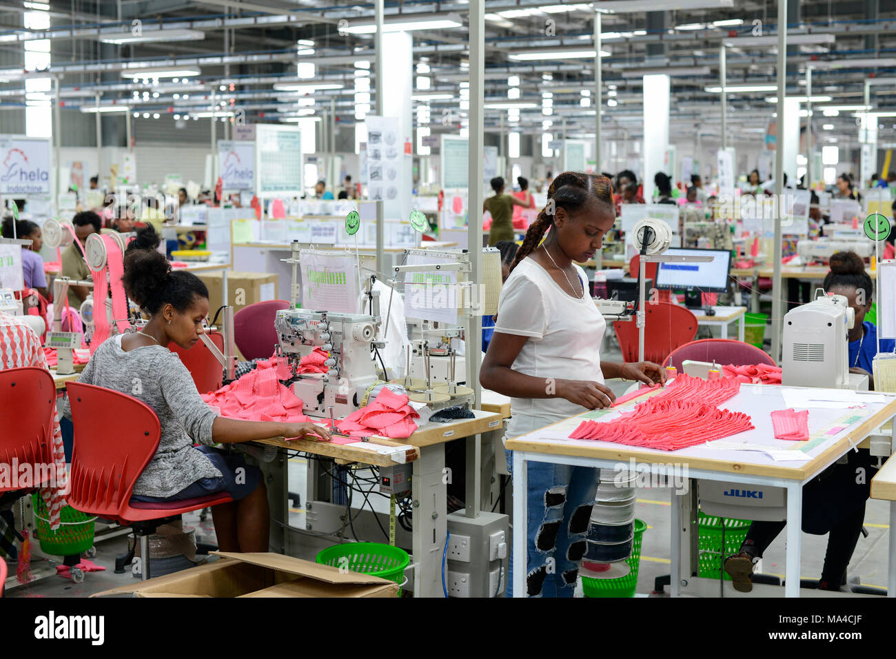 ETHIOPIA , Southern Nations, Hawassa or Awasa, Hawassa Industrial Park, chinese-built for the ethiopian government to attract foreign investors with low rent and tax free to establish a textile industry and create thousands of new jobs, textile company Hela Indochine Apparel PLC a joint venture of sri lankan and chinese companies / AETHIOPIEN, Hawassa, Industriepark, gebaut durch chinesische Firmen fuer die ethiopische Regierung um die Hallen fuer Textilbetriebe von Investoren zu vermieten, Textilfabrik Hela Indochine Apparel PLC Stock Photo