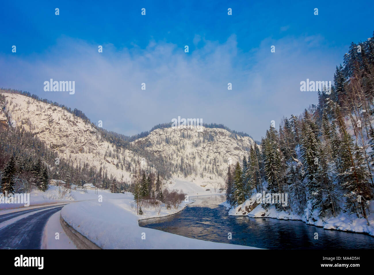 Outdoor view of winter road covered with heavy snow and ice in the ...