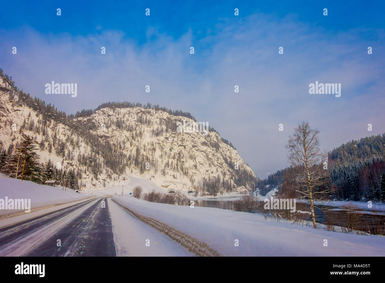 Outdoor view of winter road covered with heavy snow and ice in the ...