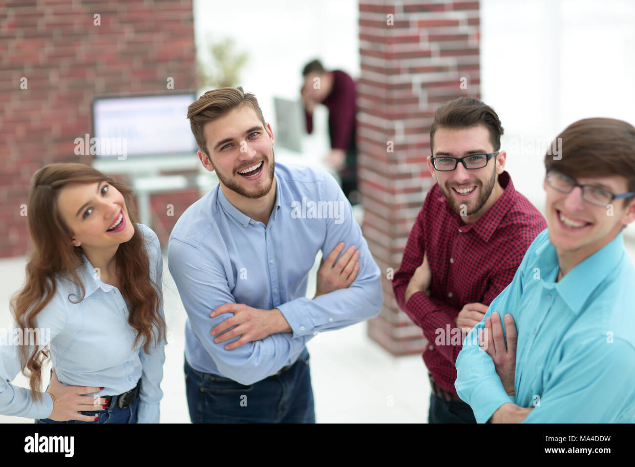 Happy smiling business team in office Stock Photo - Alamy