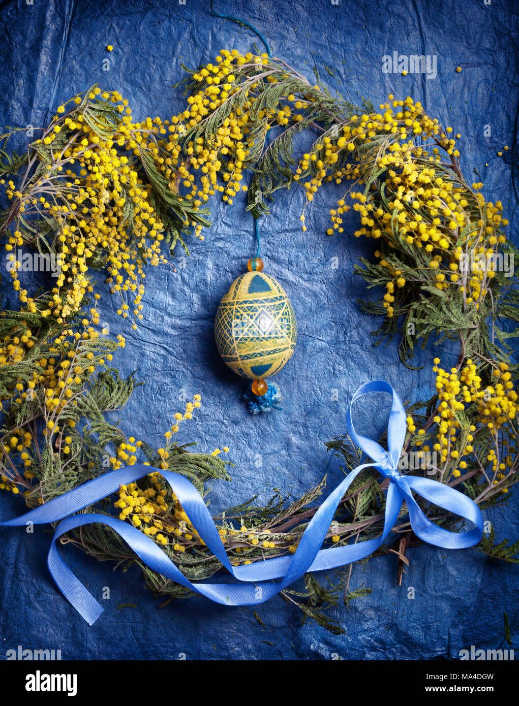 Easter empty background with Easter eggs and spring flowers. Top view with copy space. Stock Photo