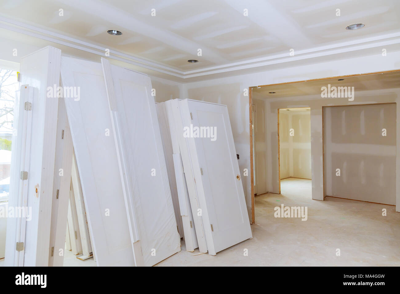 A sheetrock or drywall background. The taping and spackling have been