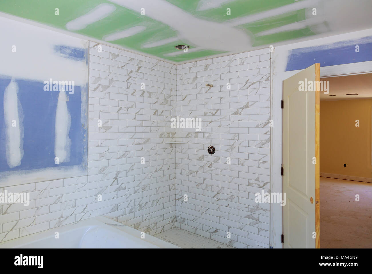 drywall tape bathroom interior with drywall completely installed Stock