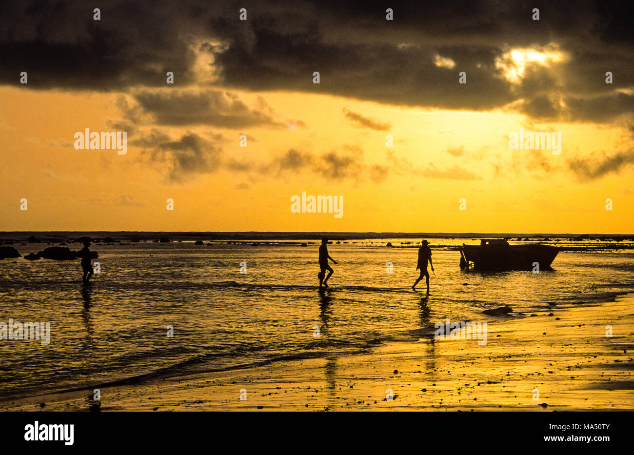 Fishing Boats and Fishing Men, Pipa Beach, Natal, Rio Grande do Norte, Brazil, South America. Stock Photo