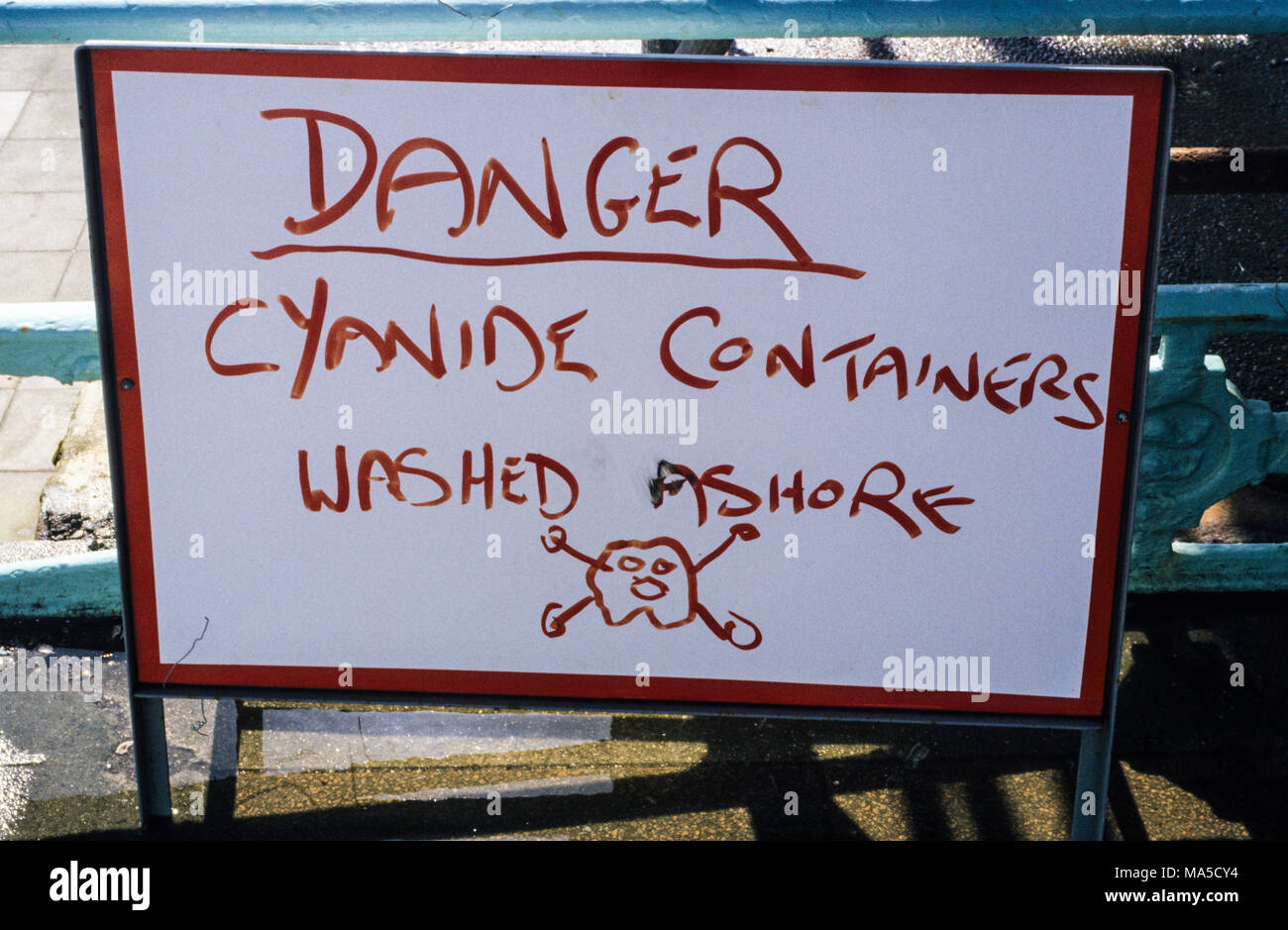Danger Cyanide Containers Washed Ashore, Brighton Beach, Brighton, East Sussex, England, UK. Stock Photo
