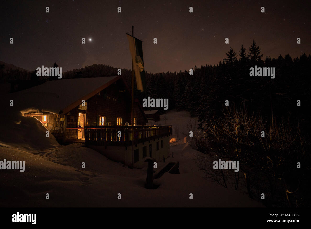 Lenggrieser Hütte (hut) in winter at night, Lenggries, Bavarian Prealps, Bavaria, Germany Stock Photo