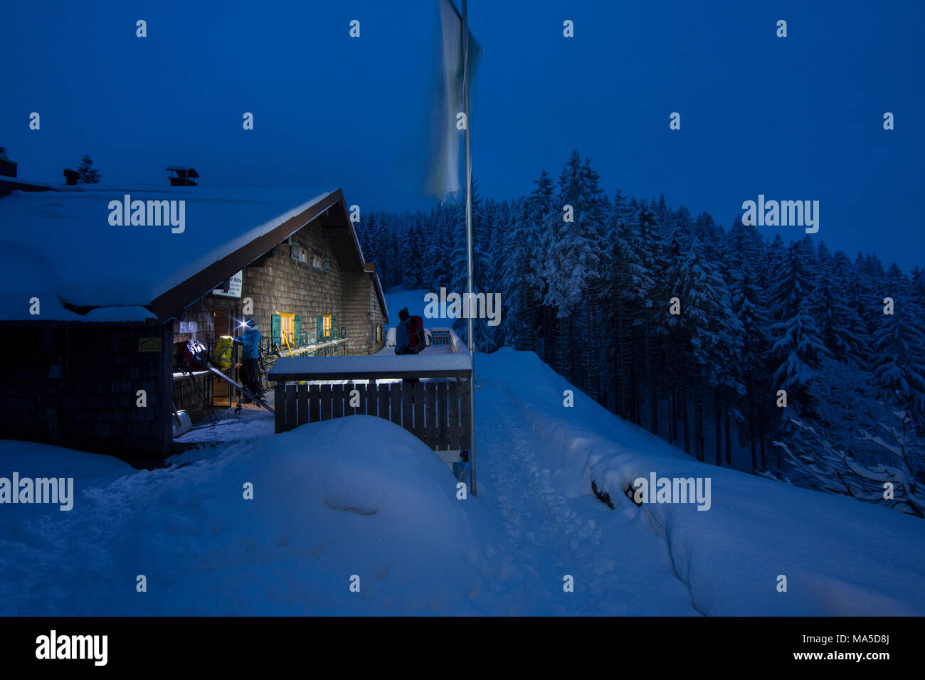 Lenggrieser Hütte (hut) in winter at night, Lenggries, Bavarian Prealps, Bavaria, Germany Stock Photo