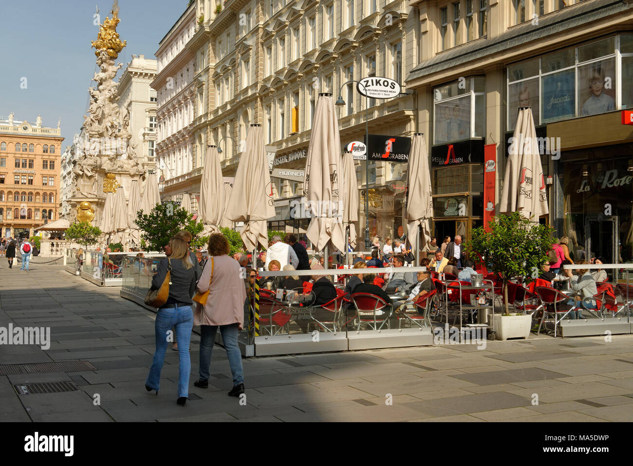 Street cafe at the Plague Column / Trinity Column on the Graben in Vienna, Austria Stock Photo