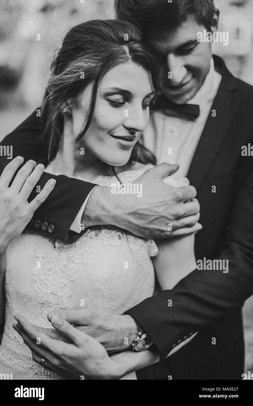 Bridal couple in love, standing, hug, smiling, detail, Stock Photo