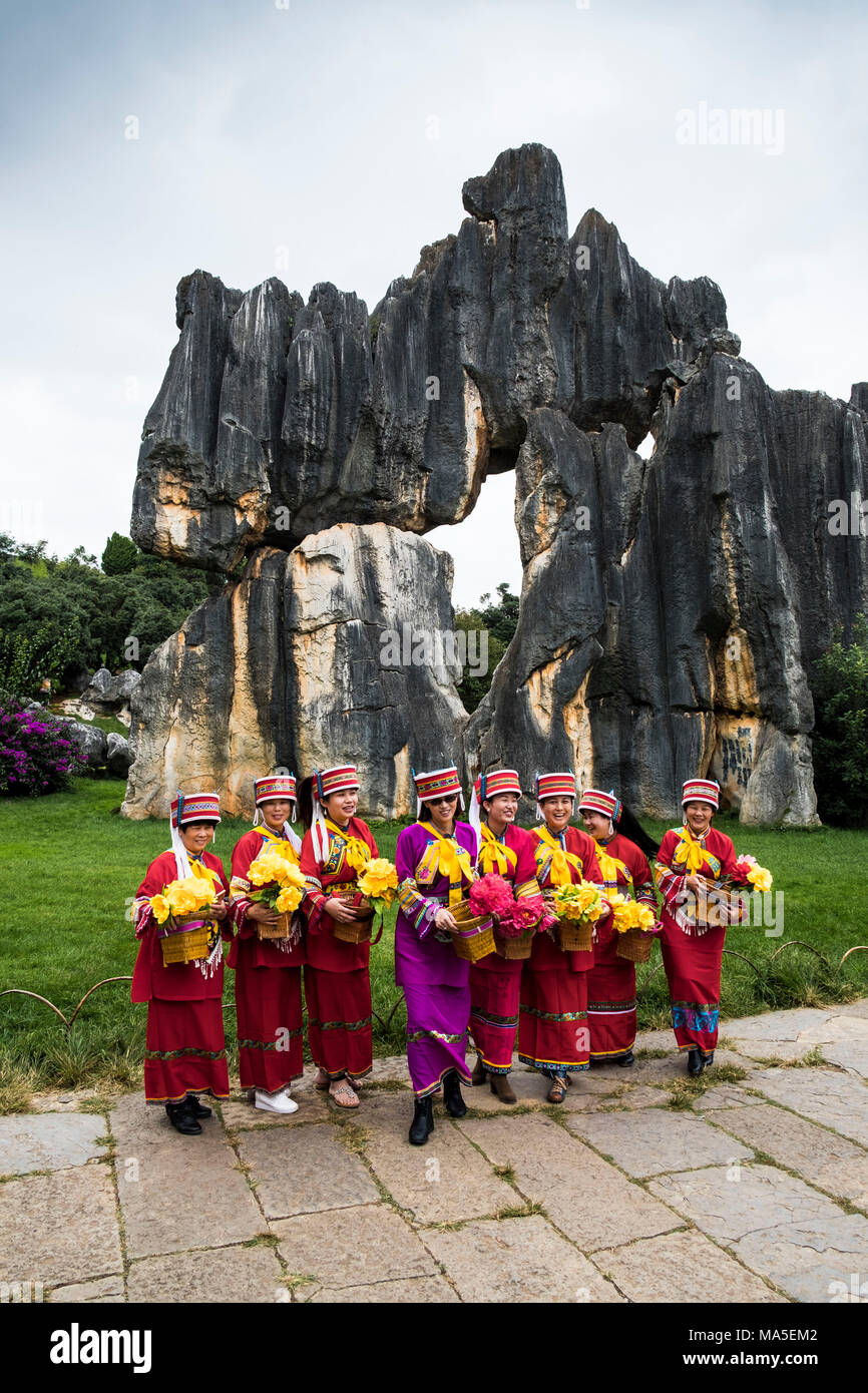 Sani minority girls with traditional dress at Stone Forest or Shilin, Kunming, Yunnan Province, China, Asia, Asian, East Asia, Far East Stock Photo