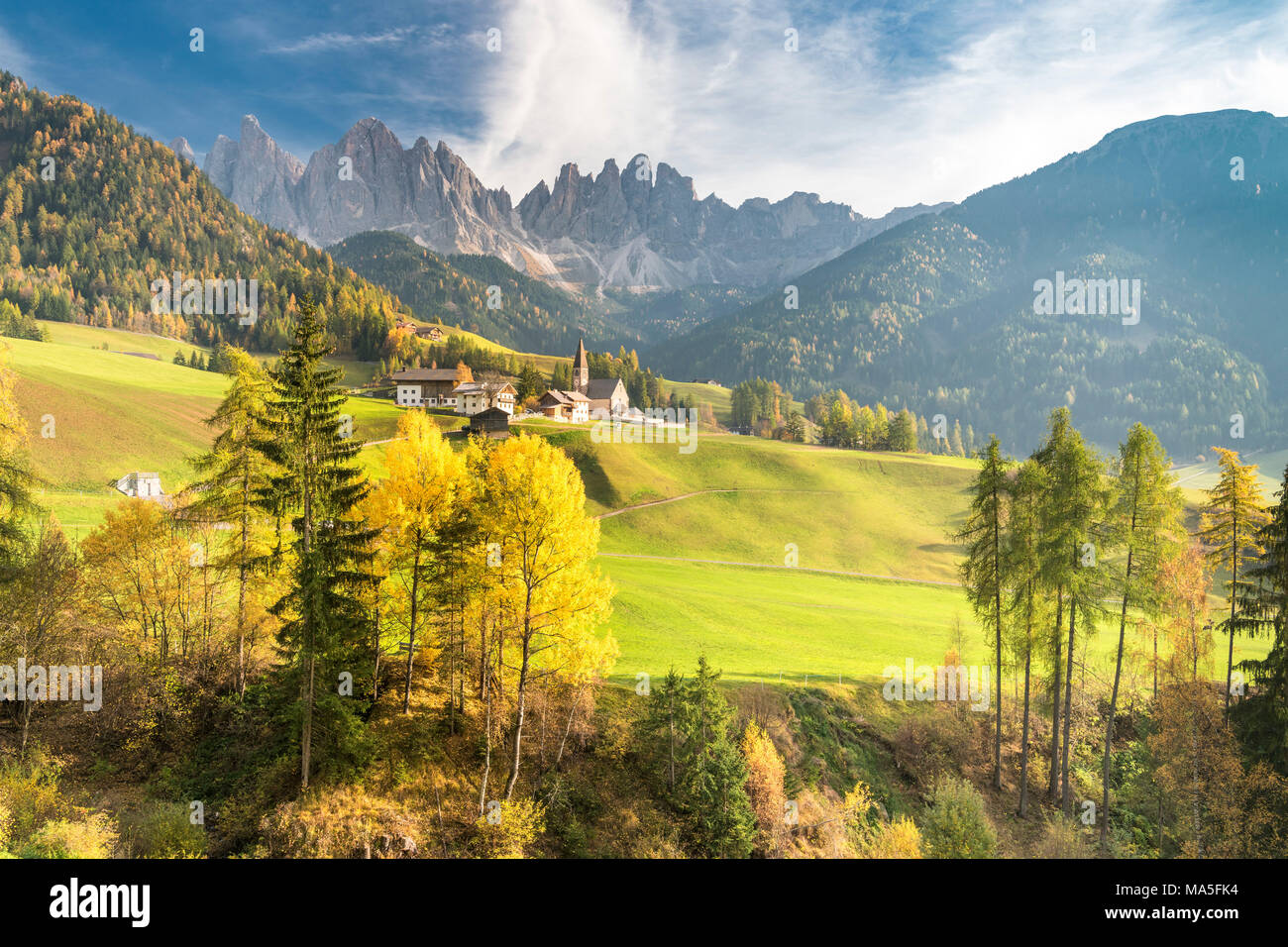 Funes Valley, Dolomites, province of Bolzano, South Tyrol, Italy. Autumn in Santa Maddalena and the peaks of Odle in the background Stock Photo