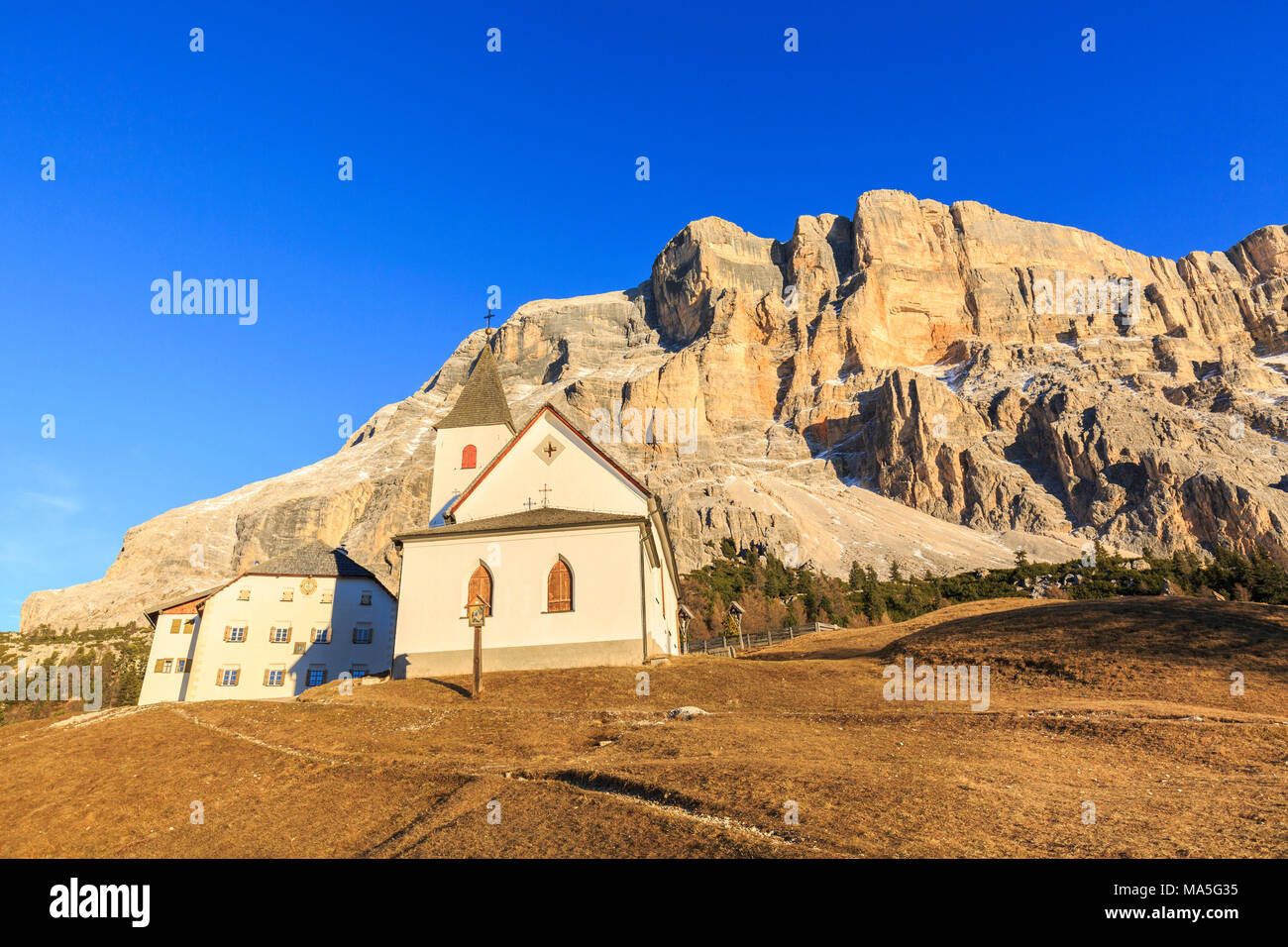 Italy, Trentino Alto Adige, Sudtirol, the church al Sas dla Crusc, in the background Sas dla Crusc mountain Stock Photo