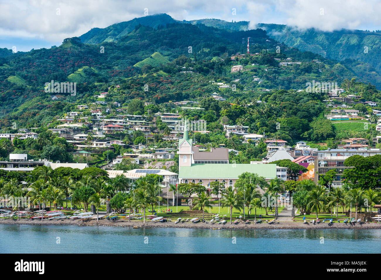 Dramatic mountains looming behind Papeete, Tahiti, French Polynesia Stock Photo