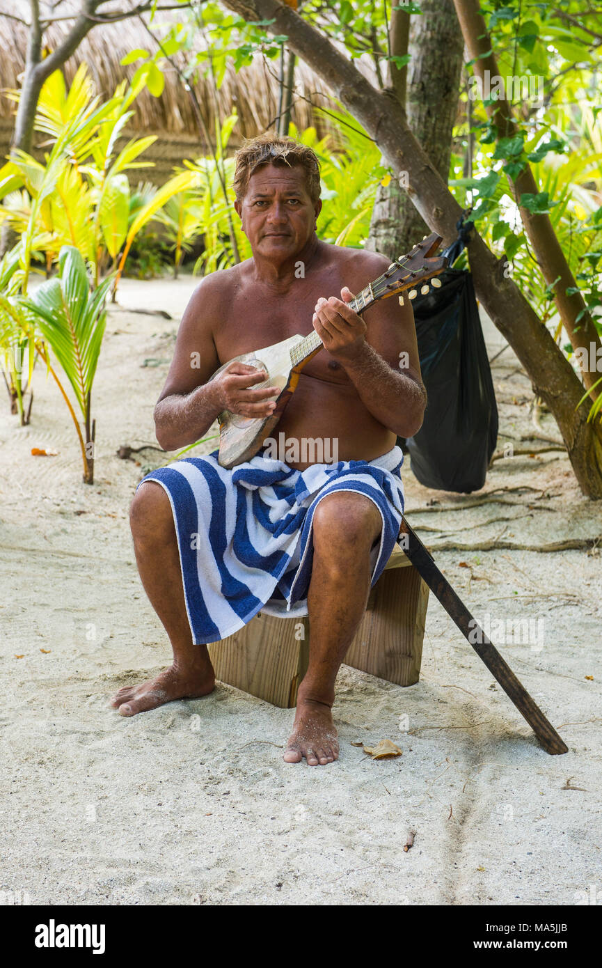 Local man playing the Ukulele, Bora Bora, French Polynesia Stock Photo -  Alamy