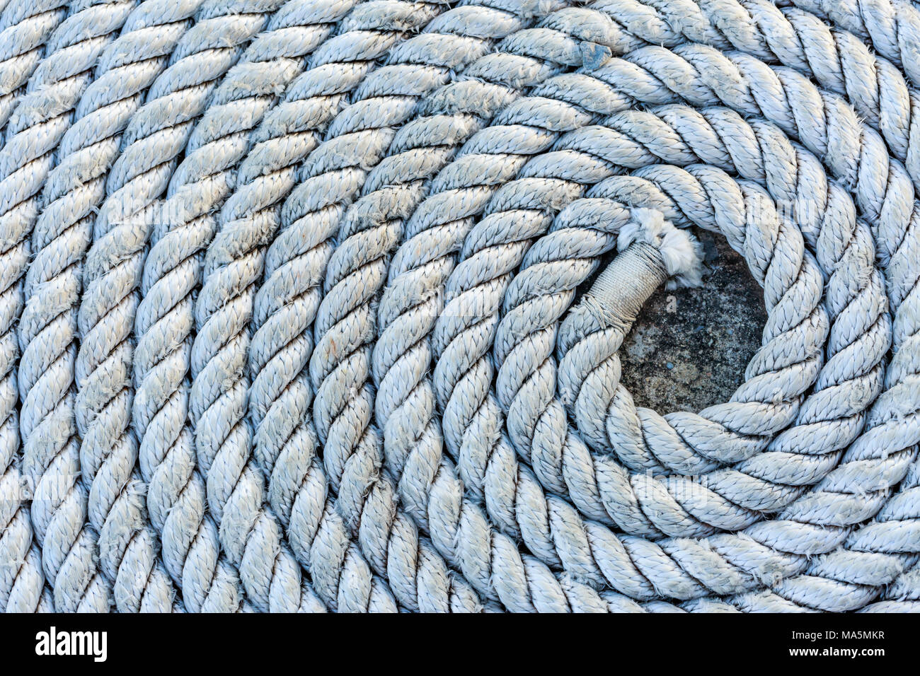 Rope folded into a spiral Stock Photo - Alamy