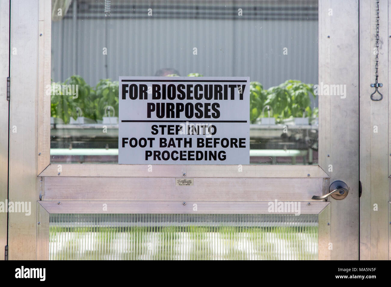 Hydroponic Agriculture.  Biosecurity Contamination Warning Sign.  Dyersville, Iowa, USA. Stock Photo